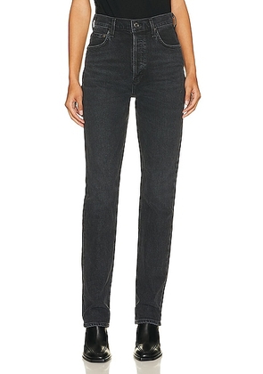 AGOLDE Freya High Rise Slim Jeans in Hoax - Black. Size 34 (also in ).