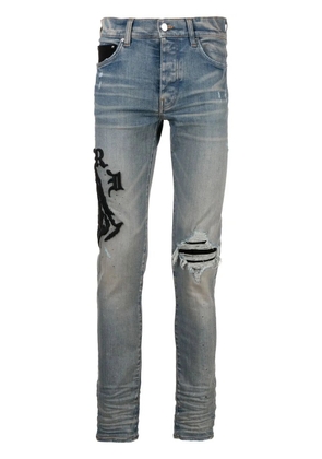 AMIRI logo-embroidered skinny jeans - Blue