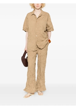 Gongdid Design crinkled flared trousers - Neutrals