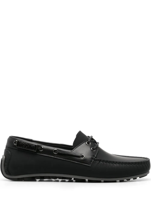 Moschino logo-plaque boat shoes - Black