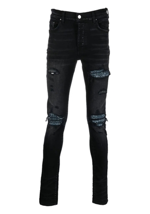 AMIRI distressed skinny jeans - Black