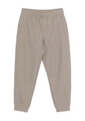 Emporio Armani logo-pattern track pants - Grey