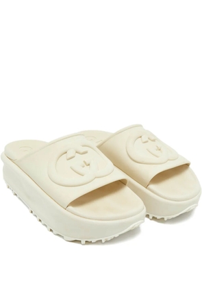 Gucci Pre-Owned embossed-logo slides - Neutrals