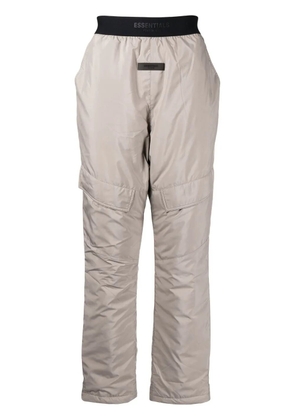 FEAR OF GOD ESSENTIALS logo-appliqué straight-leg trousers - Brown