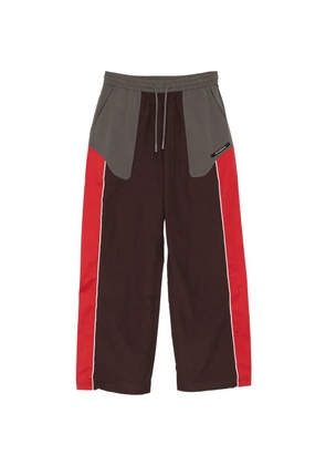 Andersson Bell logo-patched colour-block track pants - Brown