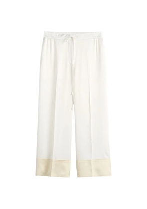TOTEME drawstring-fastening panelled trousers - White