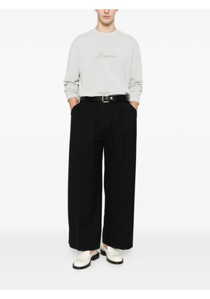 THESTROY stripe-pattern trousers - Black
