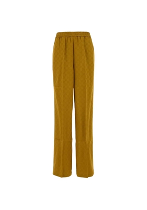 Gucci monogram-patterned trousers - Yellow