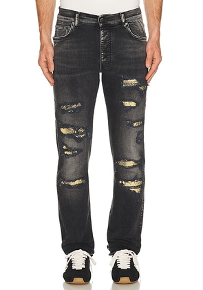 Amiri Snake Thrasher Skinny Jean in Storm Black - Black. Size 30 (also in 32, 33, 34, 36).