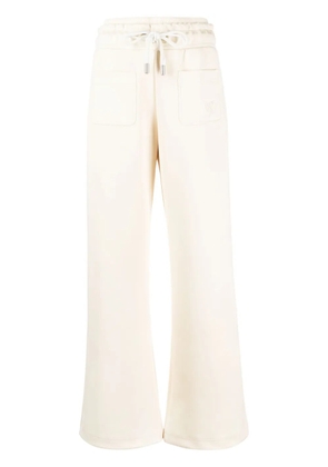 Off-White logo-embroidered flared track pants - Yellow