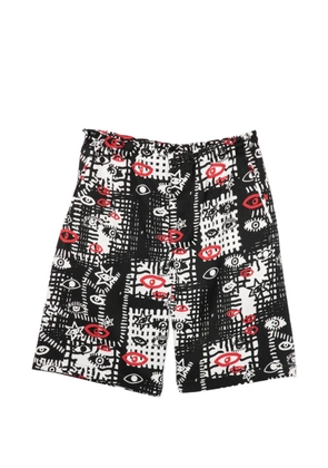 Black Comme Des Garçons graphic-print shorts