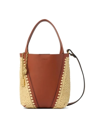 Chloé small Chloé Spin woven-pannels charm-detail bucket bag - Brown