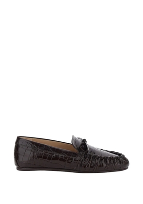 Stuart Weitzman bow embossed loafers - Brown