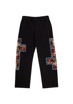 Pleasures graphic-print trousers - Black