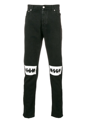 MSGM ripped logo jeans - Black