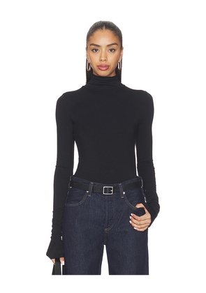 Eterne Fitted Turtleneck Top in Black. Size L. Also in M, S, XL.