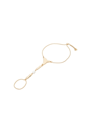 Ettika Liquid Metal Hand Chain in Metallic Gold.