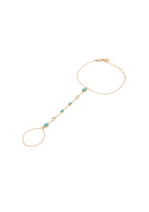 Ettika Dripping Crystal Hand Chain in Metallic Gold.