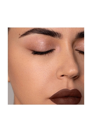 Dose of Colors It's Literally Magic Multi-Use Shimmer Stick in Metallic Bronze.