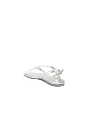SIMKHAI Carey Metallic Strappy Flat Sandal in Metallic Silver, grey. Size 39. Also in 36, 38.