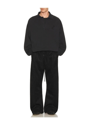 Fear of God ESSENTIALS Classic Polo Sweatshirt in Black. Size M. Also in XS, S, L, XL/1X.