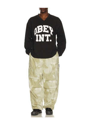 Obey Long Sleeve Football Jersey in Black. Size M. Also in S, L, XL/1X.
