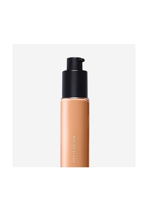 MAKE Beauty Diffusion Dew Radiant Skin Tint in Tan.