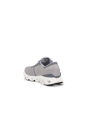 On Cloud x 4 in Grey. Size 10.5. Also in 7, 7.5, 8, 8.5, 9, 9.5, 10, 11, 11.5, 12, 12.5, 13.