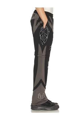 Revenge Racer Patch Convertible Pant in Black. Size M. Also in S, XL/1X.