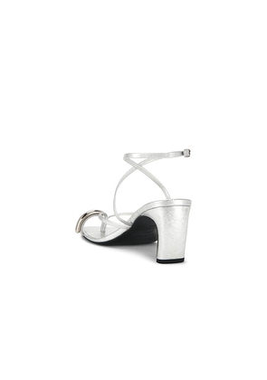 Tory Burch Pierced Strappy Heel Sandal in Metallic Silver. Size 7. Also in 8.