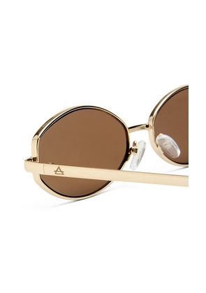 AIRE Objective Sunglasses in Metallic Gold.