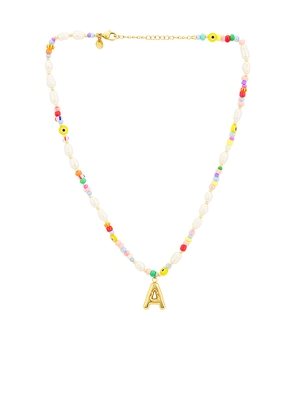 petit moments Beaded Pearl Bubble Initial Necklace in Pink,Metallic Gold. Size A. Also in B, C, D, E, F, G, H, J, K, L, M, N, O, P, R, S, T.