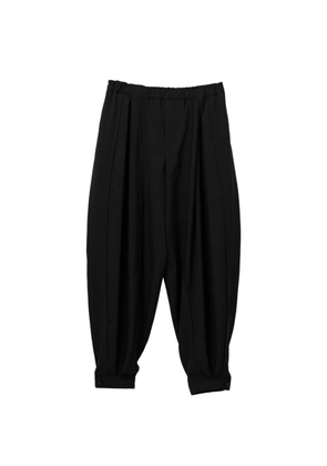 Black Comme Des Garçons pleated trousers