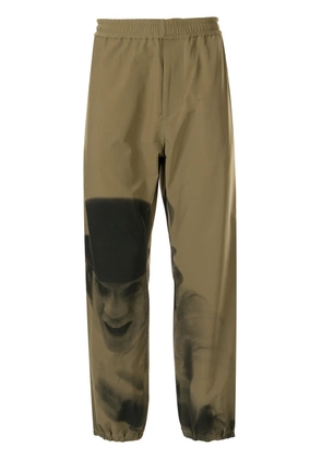 Undercover A Clockwork Orange print track pants - Green