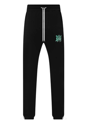 AMIRI logo-motif organic cotton track pants - Black