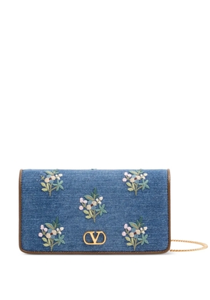 Valentino Garavani Vlogo Signature mini shoulder bag in denim with floral embroidery - Blue