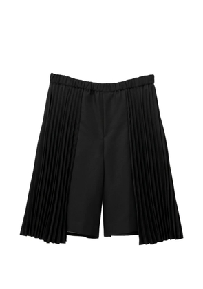 Black Comme Des Garçons pleated shorts