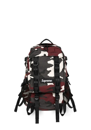 Supreme logo-detail all-over pattern backpack - Red