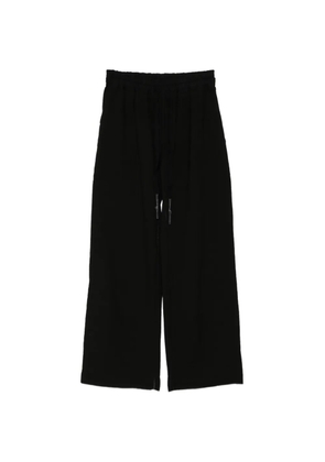 69 BY ISAAC SELLAM cargo-striped track pants - Black