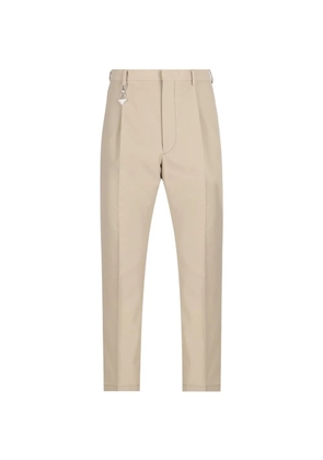 Prada triangle-charm trousers - Neutrals