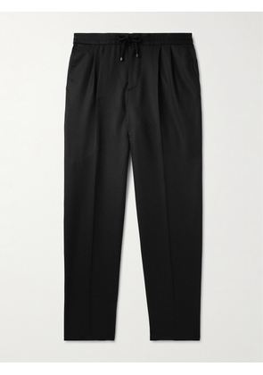 Brunello Cucinelli - Tapered Pleated Virgin Wool-Flannel Drawstring Trousers - Men - Black - IT 44