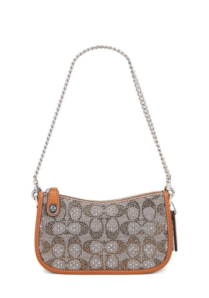 Coach Swinger 20 Bag in Brown.