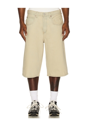 AGOLDE Fusion Skater Short in Beige. Size 36. Also in 29, 32, 33, 34.