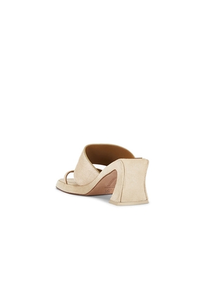 Miista Trisha Pony Asymmetric Thong Sandal in Beige. Size 36. Also in 37, 38, 39, 40.