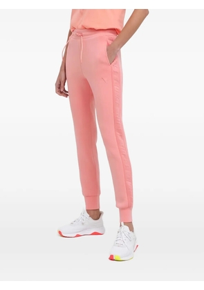GUESS USA logo-embossed track pants - Pink