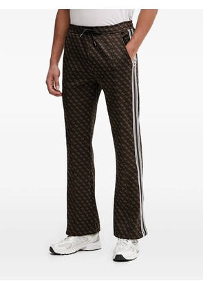 GUESS USA monogram stripe trousers - Brown