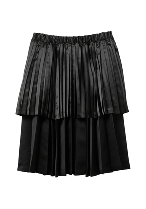 Black Comme Des Garçons pleated midi skirt