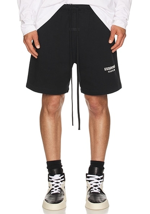 Fear of God ESSENTIALS Soccer Fleece Shorts in Jet Black - Black. Size L (also in M, S, XL/1X, XS, XXL/2X).