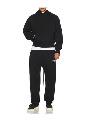 Fear of God ESSENTIALS Classic Fit Fleece Sweatpant in Black. Size XS. Also in S, M, L, XL/1X, XXL/2X.