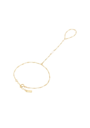 Natalie B Jewelry Yaya Hand Chain in Metallic Gold.